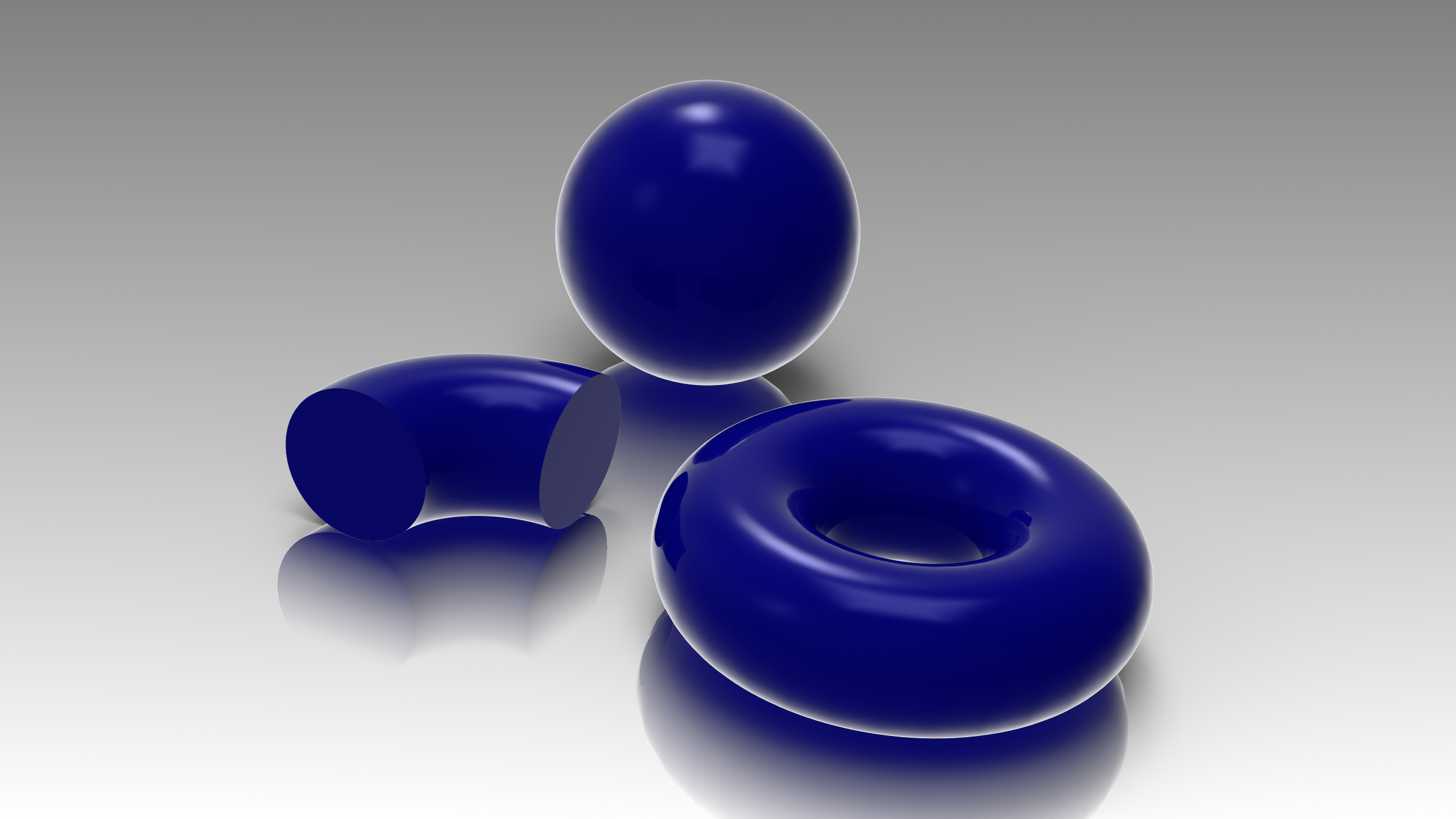 The same blue sphere, elbow and torus with View-Based Tessellation, showing smoother edge outlines